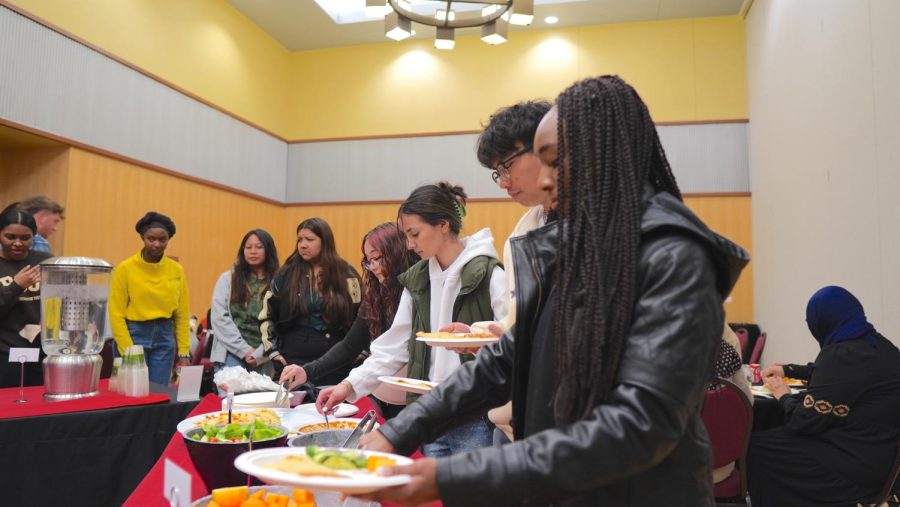 Students serve up their Ramadan dinner.